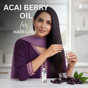 Woman with long hair holding a bottle of acai berry oil for hair care, with a bowl of acai berries on a table.