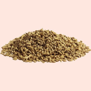 A pile of brown ajwain seeds, also known as bishop's weed or caraway seeds.