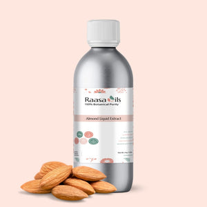 Bottle of Raasa Oils Almond Liquid Extract with almonds on a beige background