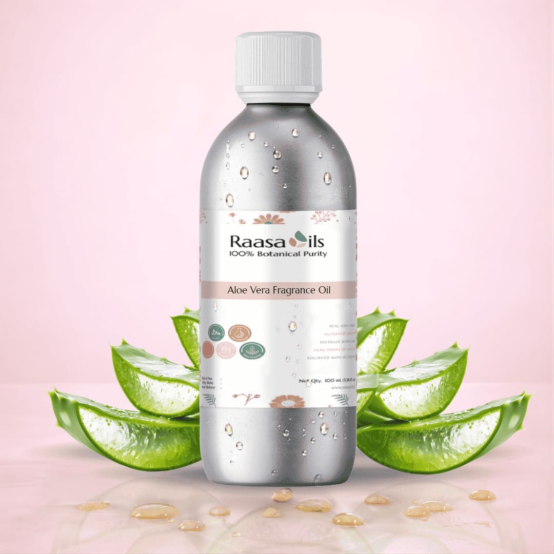 Bottle of Raasa Oils Aloe Vera Fragrance Oil with aloe vera leaves on a pink background