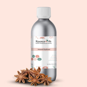 Bottle of Raasa Oils Aniseed Hydrofol with anise stars on a beige background