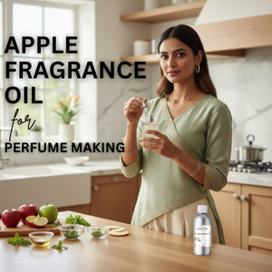 Woman in a kitchen holding a bottle of apple fragrance oil with text overlay.