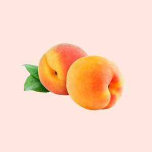 Two apricots with a green leaf, isolated on a white background.