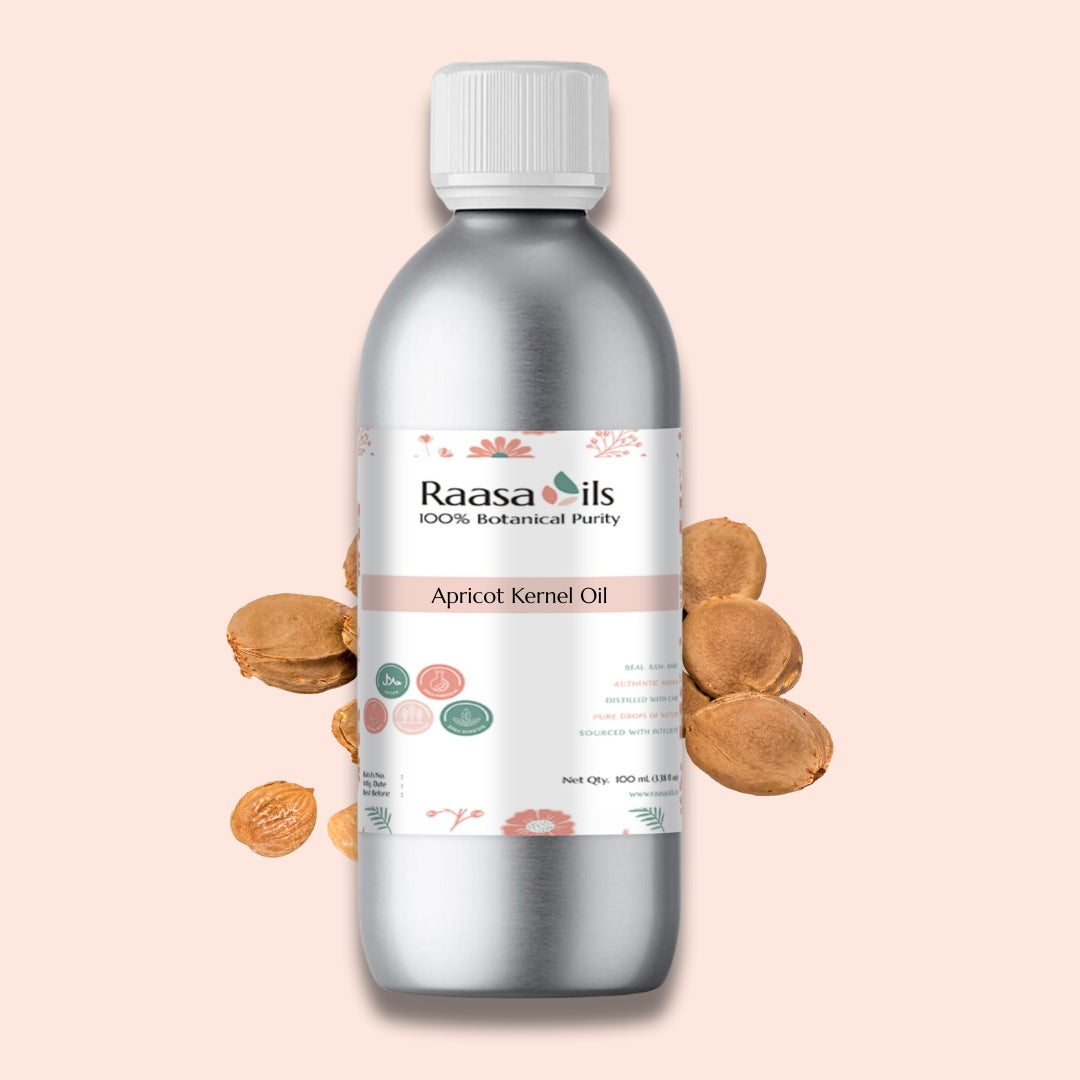 Raasa Oils apricot kernel oil bottle with almonds on a pink background