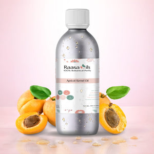 Bottle of Raasa Oils Apricot Kernel Oil with apricots on a pink background