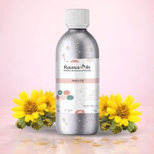 Raasa Oils Arnica Oil bottle with yellow flowers on a pink background