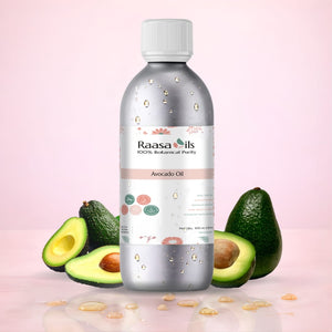 Bottle of Raasa Oils Avocado Oil with avocados on a pink background