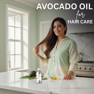 Woman with long hair standing in a kitchen with avocado oil products on the counter.