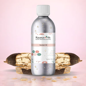 Bottle of Raasa Oils Baobab Oil with baobab fruit on a pink background