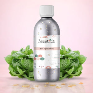 Bottle of Raasa Oils Basil Liquid Extract with basil leaves on a pink background