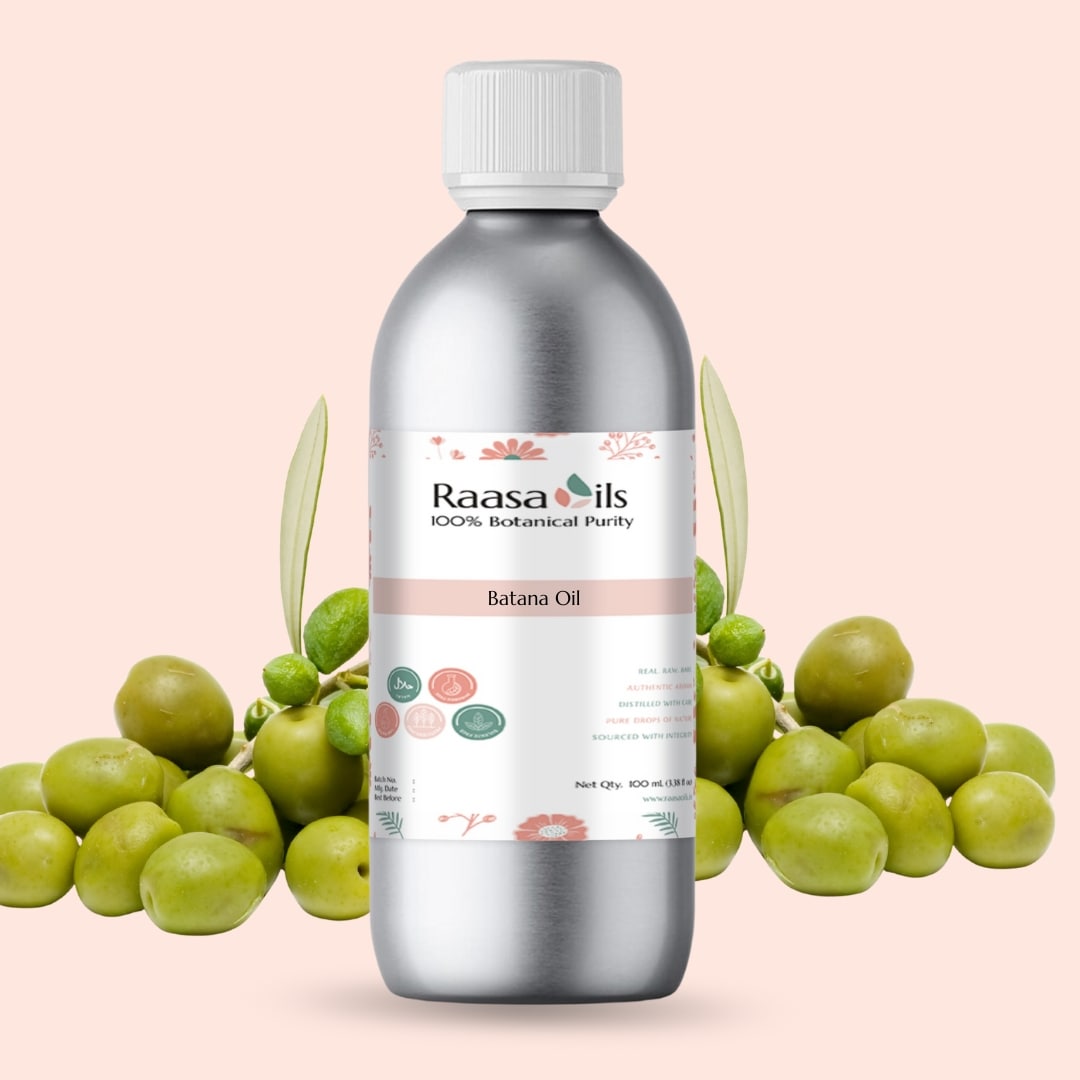 Bottle of Raasa Oils batana oil with batana leaves and fruit on a pink background