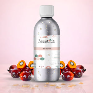 Raasa Oils bottle with banana fruits on a pink background