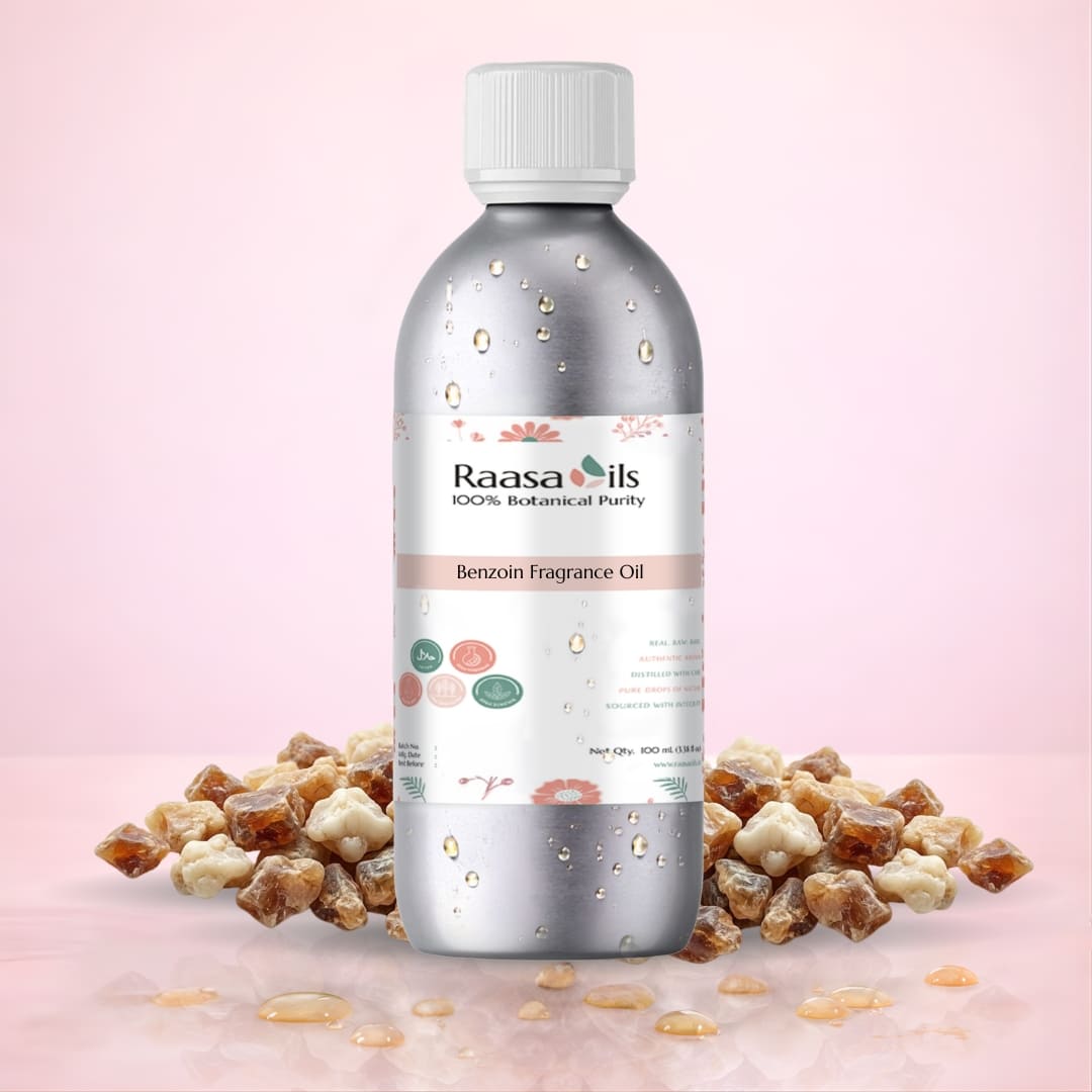 Bottle of Raasa Oils Benzoin Fragrance Oil with Benzoin resin on a pink background