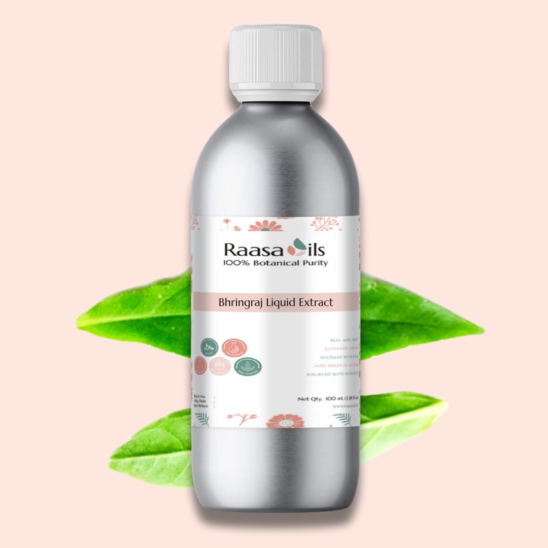 Bottle of Raasa Oils Bhringraj Liquid Extract with green leaves on a light pink background