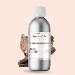 Bottle of Raasa Oils Black Musk Fragrance Oil on a light pink background