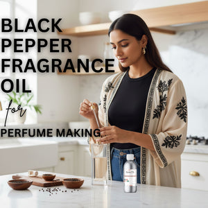Woman in a kitchen preparing black pepper fragrance oil for perfume making.