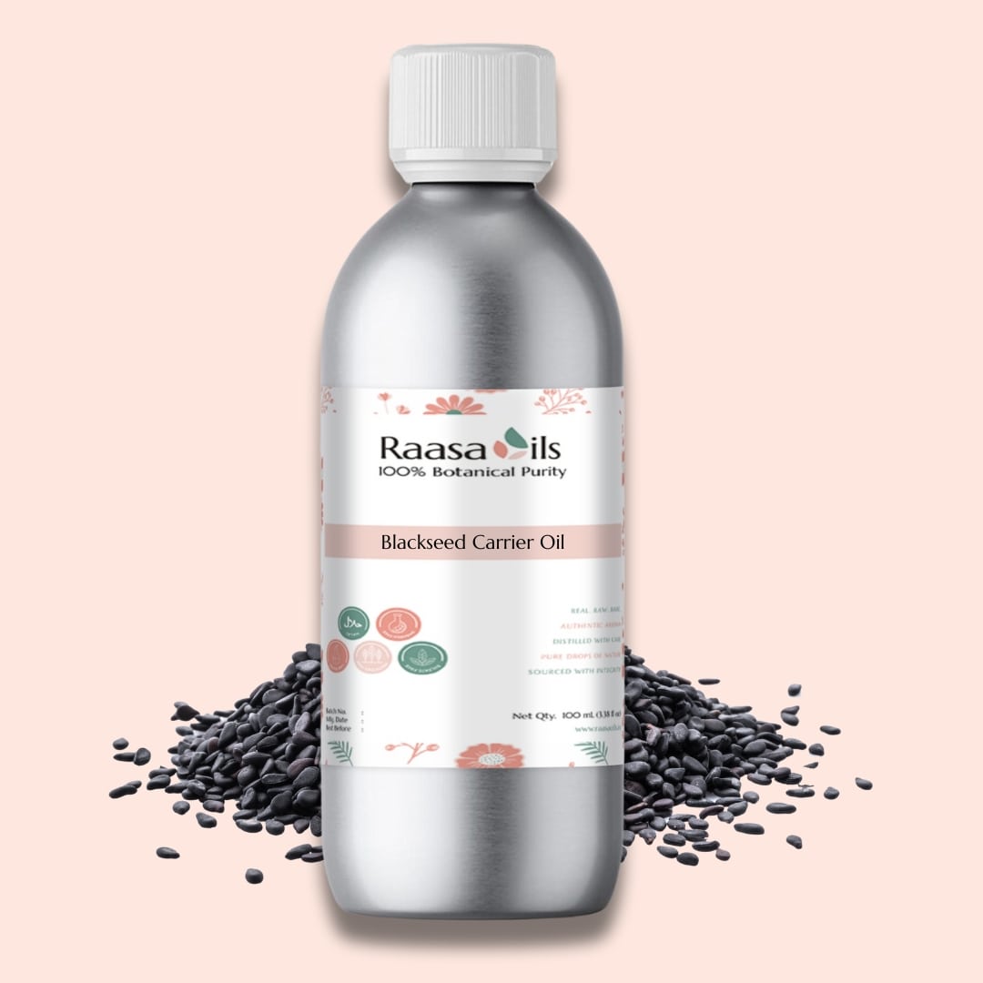 Bottle of Raasa Oils Blackseed Carrier Oil with black seeds on a pink background