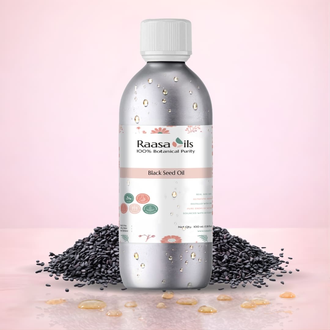 Bottle of Raasa Oils black seed oil with black seeds on a pink background