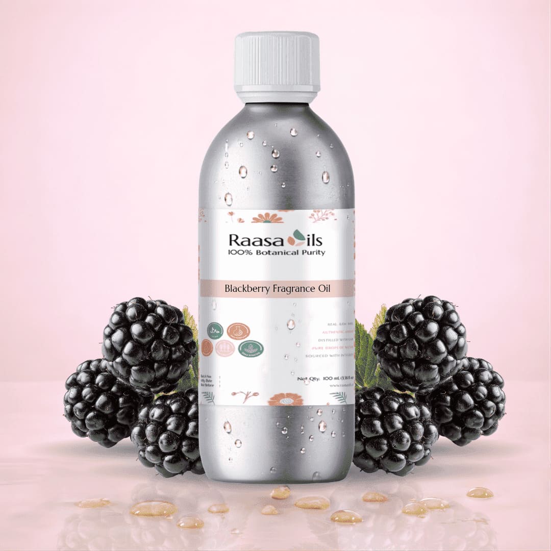 Bottle of Raasa Oils Blackberry Fragrance Oil with blackberries on a pink background