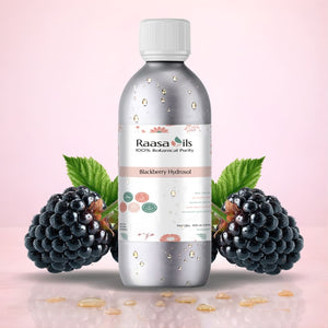 Raasa Oils Blackberry Hydrosol bottle with blackberries and leaves on a pink background