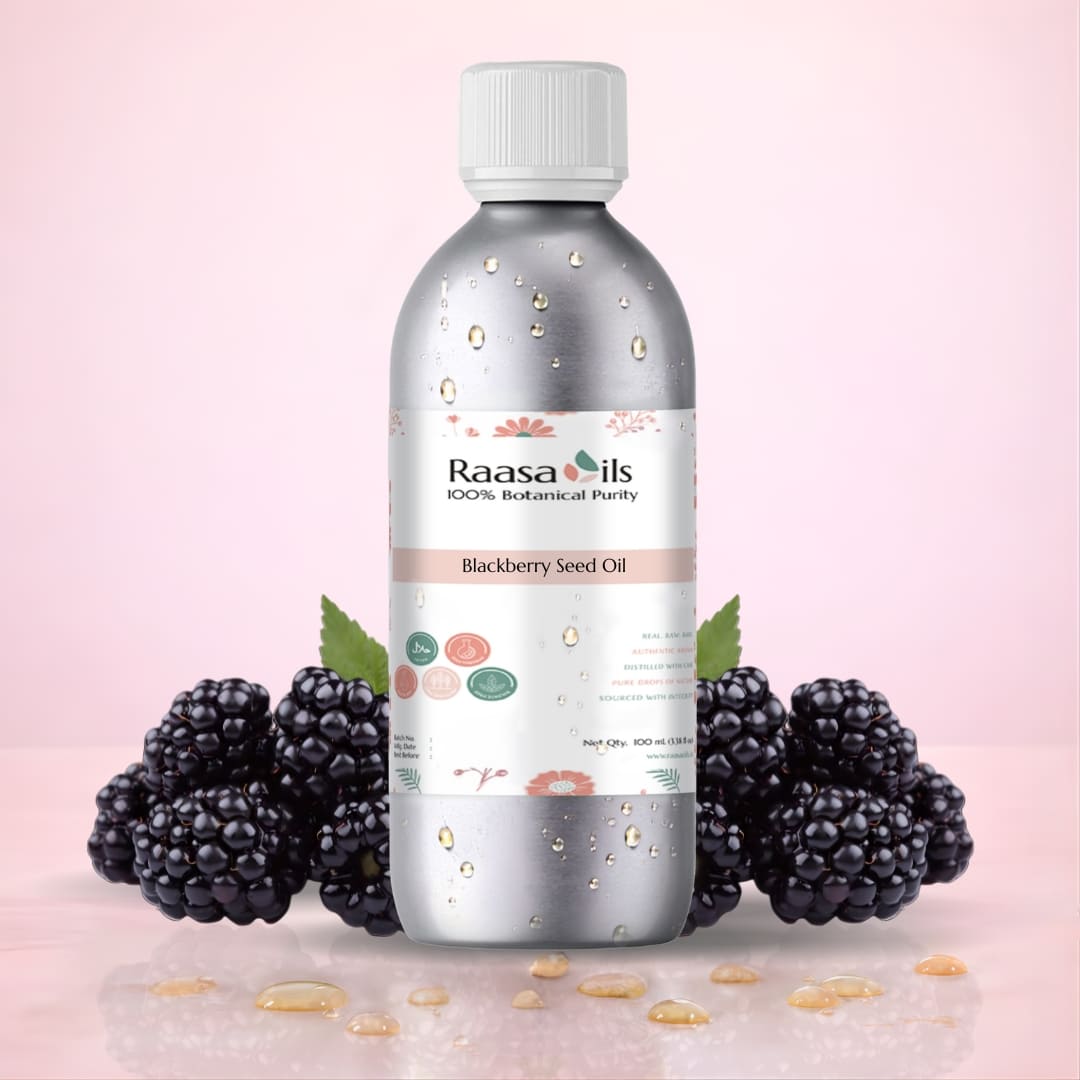 Bottle of Raasa Oils Blackberry Seed Oil with blackberries on a pink background