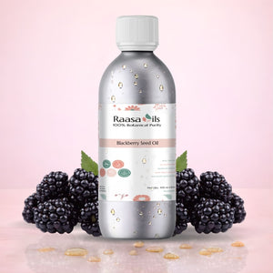 Bottle of Raasa Oils Blackberry Seed Oil with blackberries on a pink background