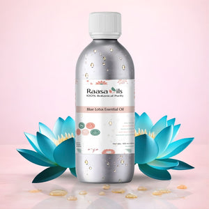 Raasa Oils Blue Lotus Essential Oil bottle with lotus flowers on a pink background
