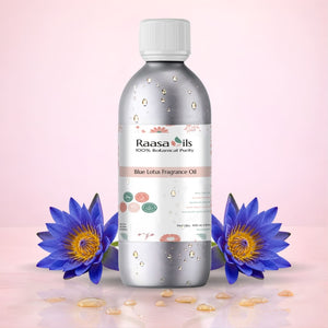 Raasa Oils Blue Lotus Fragrance Oil bottle with blue lotus flowers on a pink background