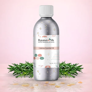 Raasa Oils Galium Essential Oil bottle with rosemary leaves on a pink background