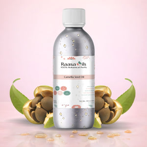 Bottle of Raasa Oils Camellia Seed Oil with botanical elements on a pink background