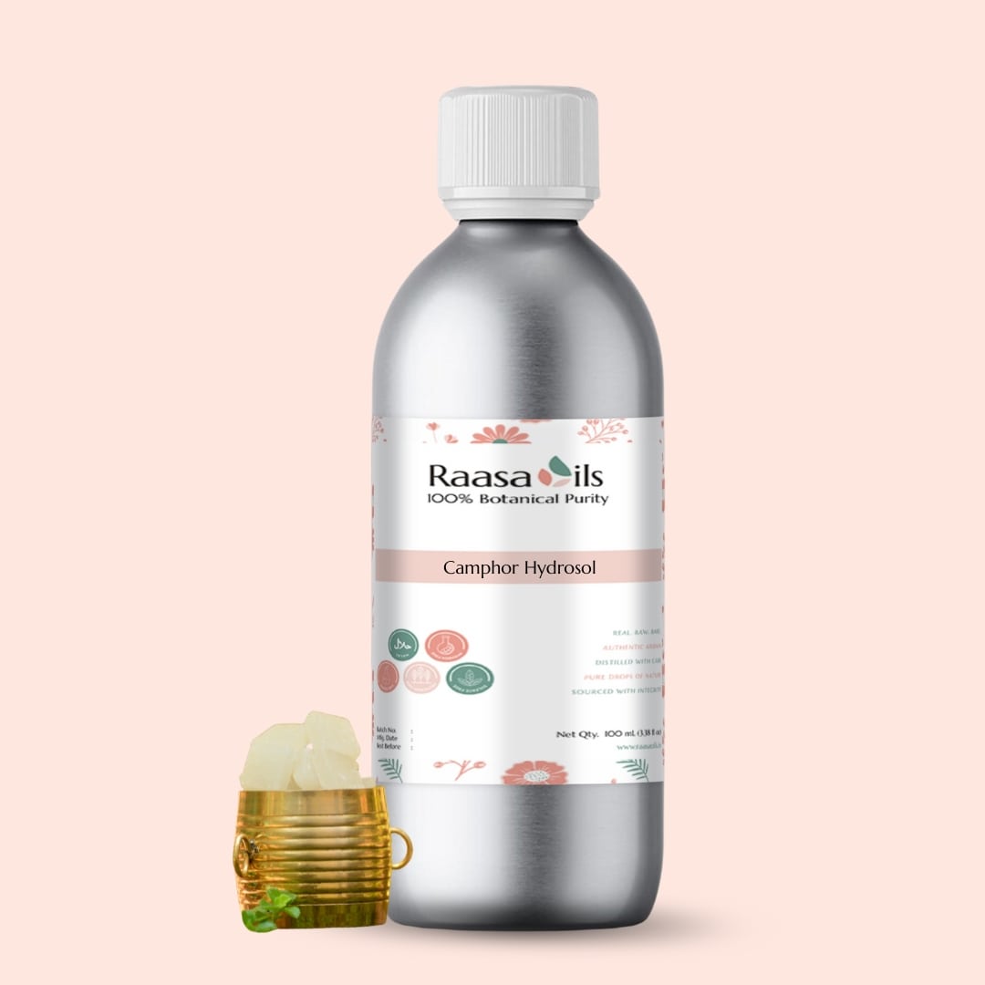 Bottle of Raasa Oils Camphor Hydrosol on a light pink background