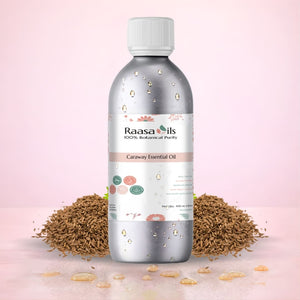 Raasa Oils caraway essential oil bottle with caraway seeds and leaves on a pink background
