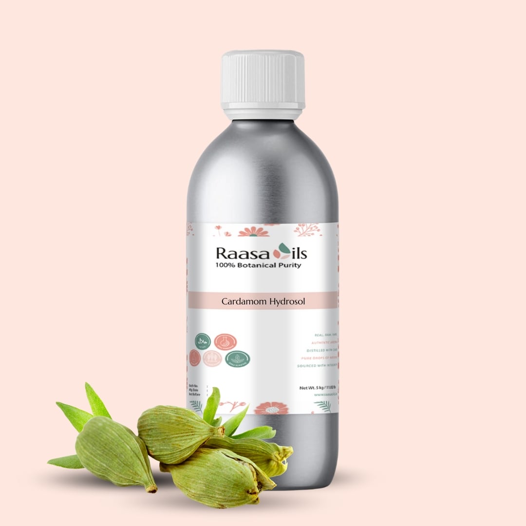 Bottle of Raasa Oils Cardamom Hydrosol with cardamom pods on a light pink background