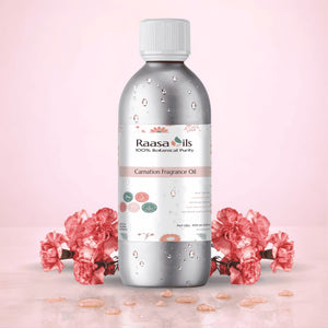 Bottle of Raasa Oils Carnation Fragrance Oil with pink flowers on a light pink background