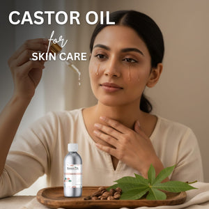 Woman applying castor oil to her face with a dropper, surrounded by castor seeds and leaves on a wooden tray.