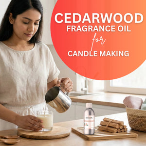 Woman pouring liquid into a glass with cedarwood fragrance oil and candles on a table.