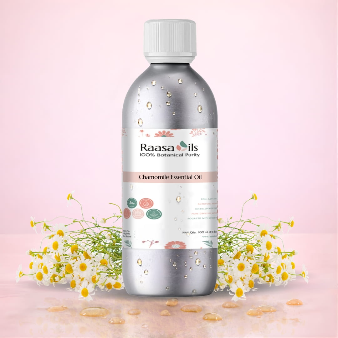 Raasa Oils chamomile essential oil bottle with flowers on a pink background