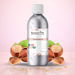 Bottle of Raasa Oils Chaulmoogra Oil with nuts on a pink background