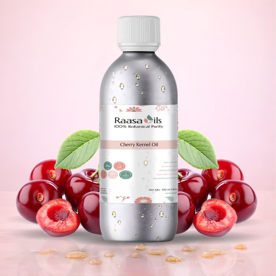 Bottle of Raasa Oils Cherry Kernel Oil with cherries on a pink background