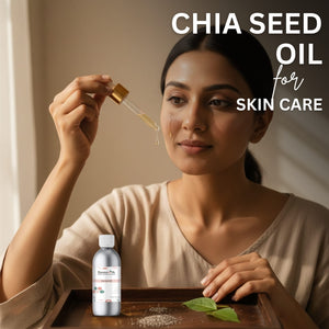 Woman applying chia seed oil to her face with a dropper, product displayed on a wooden tray.