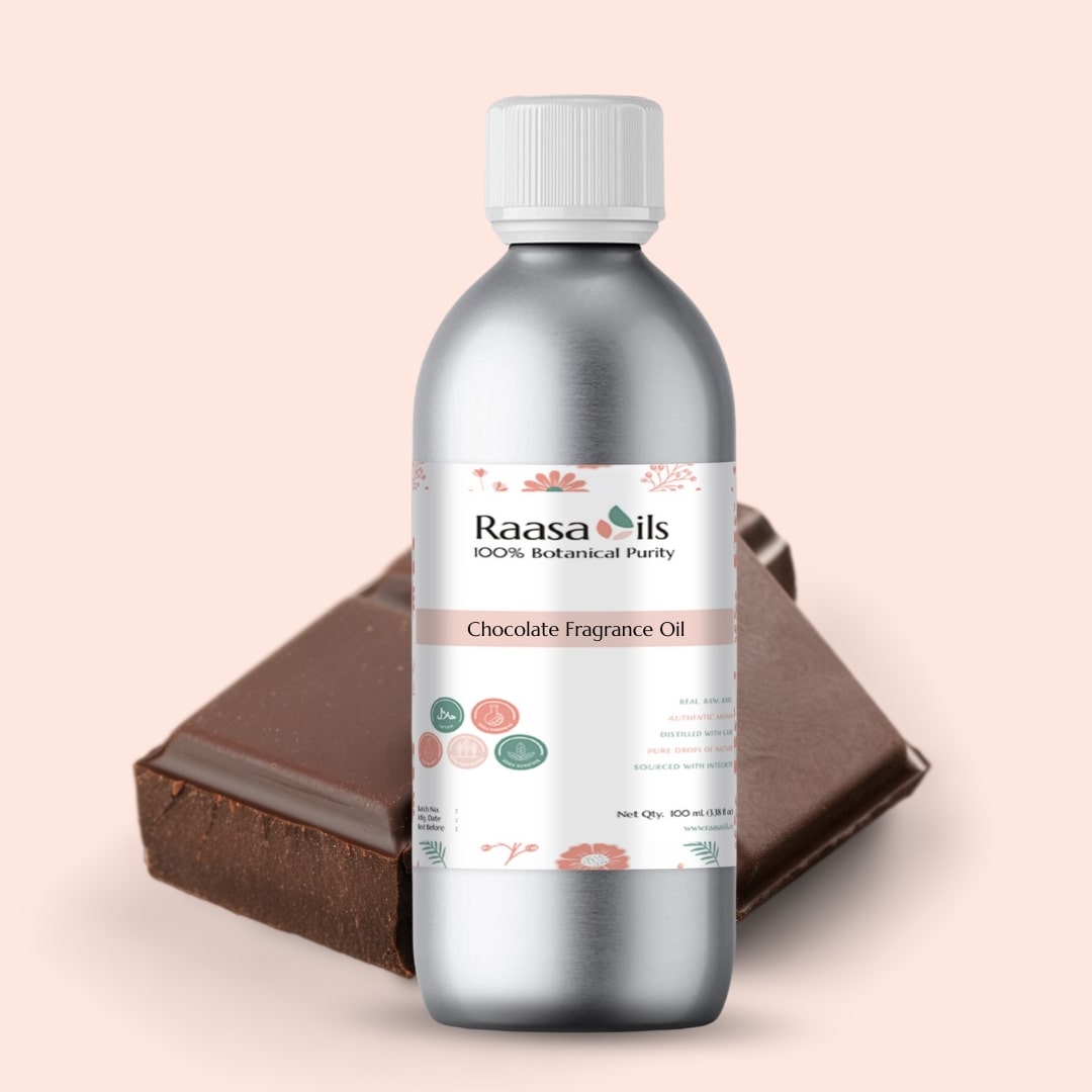 Bottle of Raasa Oils Chocolate Fragrance Oil with a piece of chocolate on a beige background