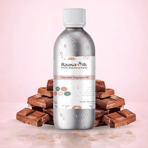 Bottle of Raasa Oils Chocolate Fragrance Oil with chocolate bars on a pink background