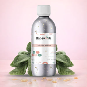 Bottle of Raasa Oils Clary Sage Hydrosol with green leaves on a pink background