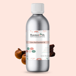 Raasa Oils Clove Bud Essential Oil bottle on a light pink background