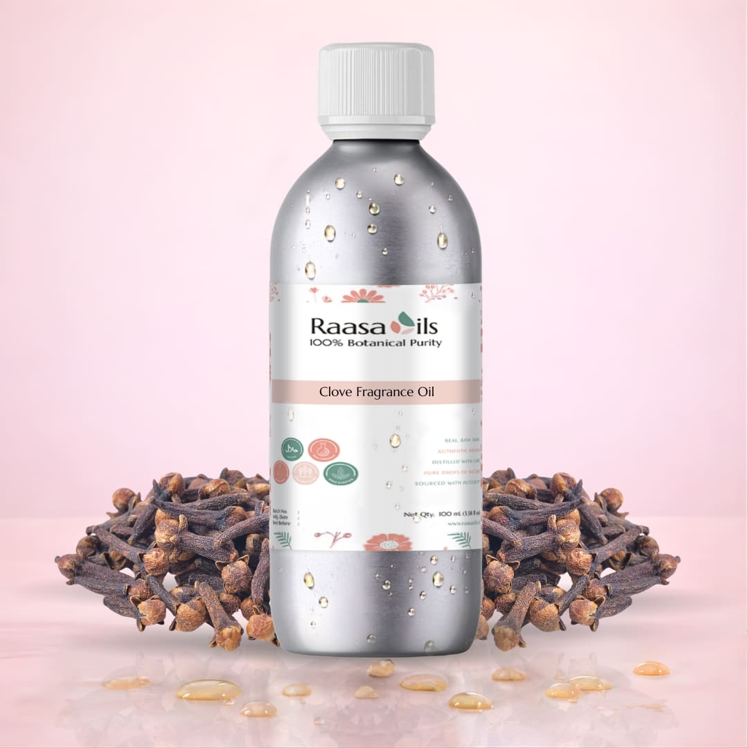 Raasa Oils clove fragrance oil bottle with cloves on a pink background