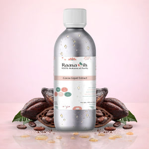 Bottle of Raasa Oils Cocoa Liquid Extract with cocoa beans and leaves on a pink background