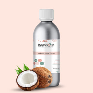 Bottle of Raasa Oils Coconut Liquid Extract with coconuts on a beige background
