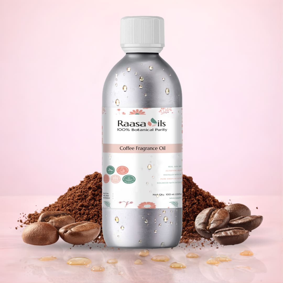 Bottle of Raasa Oils Coffee Fragrance Oil with coffee beans and grounds on a pink background