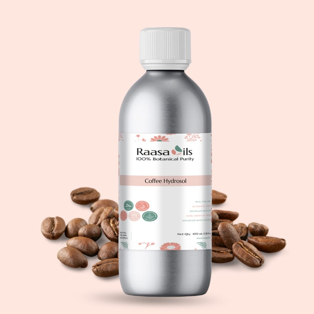 Bottle of Raasa Oils Coffee Hydroal with coffee beans on a beige background
