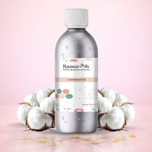 Bottle of Raasa Oils Cottonseed Oil with cotton flowers on a pink background